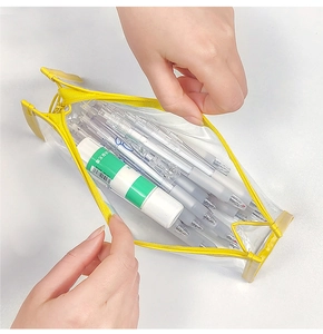 Top view of yellow transparent PVC stationery bag showing large capacity and zipper opening