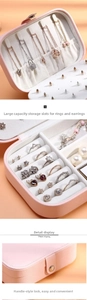 Detailed pink PU leather jewelry box interior with necklace hooks and ring slots