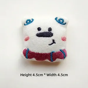 Close-up of 4.5cm cute plush cartoon dog accessory with embroidery details