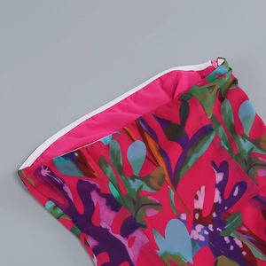 Detail of floral printed dress featuring vibrant patterns and a white invisible zipper closure