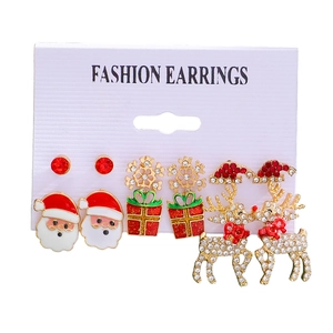 Christmas earring set with Santa Claus, snowflakes and reindeer on a display card