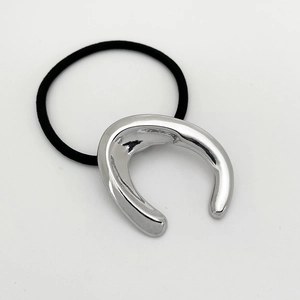 Detail of silver U-shaped metal buckle with high elasticity black hair tie