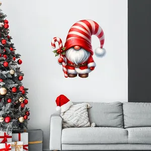Detail of Christmas gnome wall sticker with candy cane in a cozy living room decor