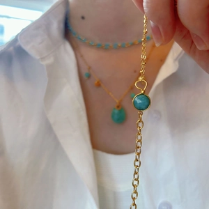 Minimalist gold titanium chain bracelet featuring a round turquoise stone pendant