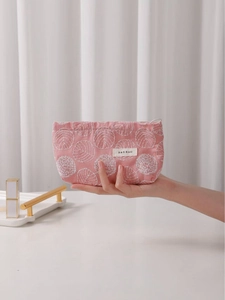 Pink cotton linen cosmetic bag with delicate white leaf embroidery and zipper closure