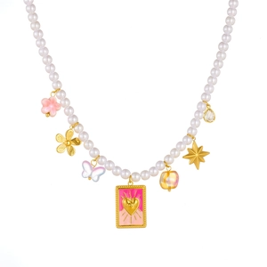 Chic pearl necklace with pink gradient tarot card and gold star charms on white backdrop