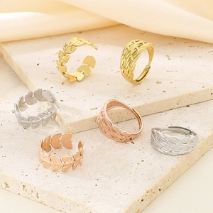 Exaggerated stainless steel woven cross rings with leaf texture in gold and silver