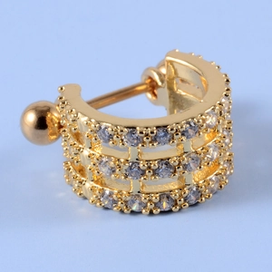 Detailed macro view of gold-plated cartilage earring with micro-pave cubic zirconia crystals