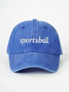 Detail of white sportsball embroidery on a vintage washed navy blue cotton baseball cap