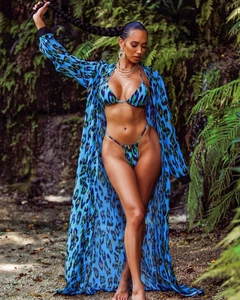 Detail of blue leopard print chiffon cover-up with matching bikini set for beachwear