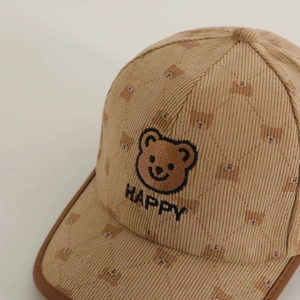 Khaki corduroy kids baseball cap featuring embroidered bear face and happy lettering