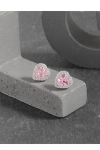 Macro detail of silver heart stud earrings with pink zircon and micro-pave setting