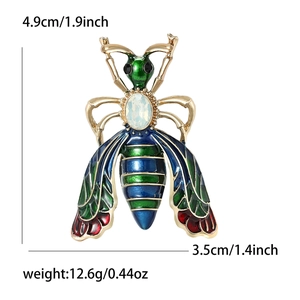 Enamel bee brooch with rainbow gemstone and dimension markings on a white background