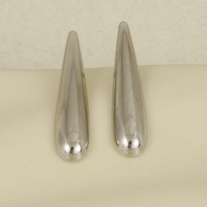 Detailed macro shot of long polished 304 stainless steel teardrop earrings in silver color