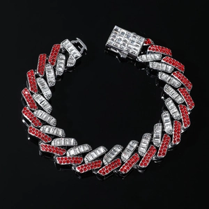 Macro shot of 15mm silver cuban link bracelet with red and white inlaid stones