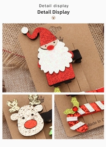 Detail of Christmas hair clip set featuring glittery Santa, reindeer and candy cane motifs