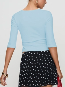 Slim fit light blue rib-knit crop top with half sleeves shown from the back view