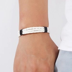 Detail view of multi-layer white braided leather bracelet with black metal clasps