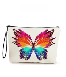 Detail view of colorful butterfly print on thick canvas cosmetic bag with black zipper