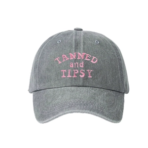 Vintage grey washed cotton baseball cap featuring pink TANNED and TIPSY embroidery