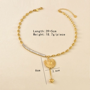 Detailed view of golden coffee bean chain with heart pendant and crystal accents