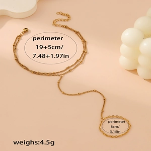Detail view of gold beaded finger bracelet chain with precise size dimensions in centimeters