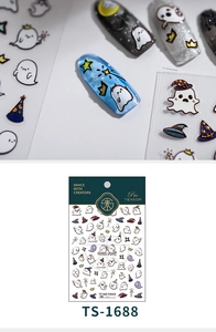 Close-up of 5D embossed Halloween nail stickers featuring cute white ghosts and gold stars