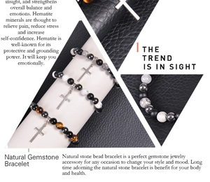 Macro detail of beaded bracelets with tiger eye, black agate and silver cross pendant