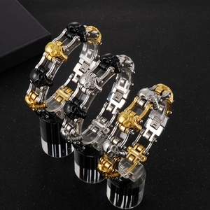 Detailed close-up of 316L stainless steel skull chain bracelets in gold black and silver