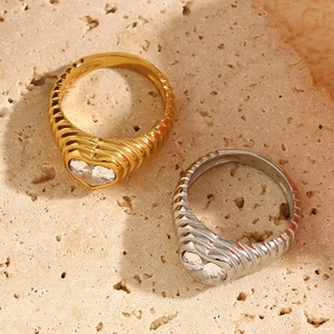 Macro shot of 18K gold plated heart zircon ring with vintage twisted thread texture