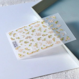 Macro view of 5D white jasmine flower nail art stickers with embossed relief texture