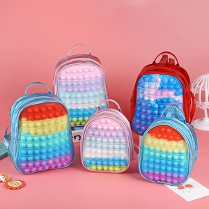 Detail of colorful silicone bubble backpacks in various sizes with stress-relief design