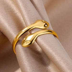 Macro detail of 18k gold plated stainless steel double snake head bypass ring