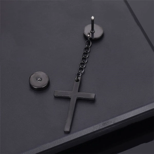 Matte black cross drop earrings with chain in punk style on a textured dark background