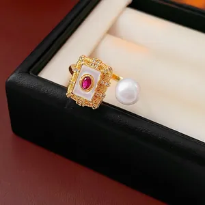 Gold plated square ring with red ruby gemstone and round pearl in vintage style