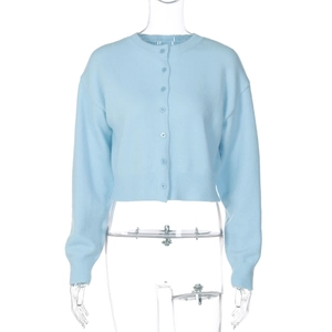 Detailed view of light blue knitted cardigan with round neck and matching front buttons