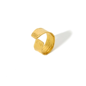 Close-up of golden adjustable ring featuring a unique handcrafted hammered metal texture