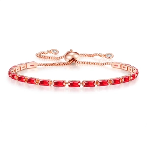 Detail of rose gold tennis bracelet with rectangular red zircons and adjustable slider clasp