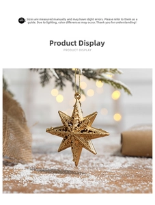 Detail of golden 8-pointed Christmas star with embossed bead texture and gold hanging cord