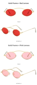 Detail view of oval punk sunglasses with gold metal frame and red or pink ocean lenses