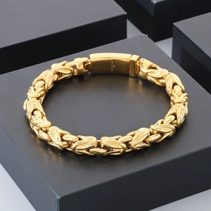 Macro shot of 18k gold plated stainless steel curb chain bracelet on display