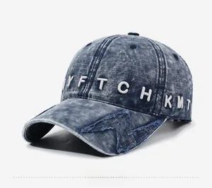 Detail of vintage washed navy baseball cap featuring 3D letter embroidery and star patch
