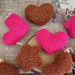 Plush lamb wool heart and star ornaments in rose red and brown for Christmas decor