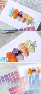 Detailed view of 3D embossed knit texture nail stickers in vibrant gradient colors