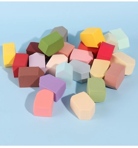 Macro shot of multi-colored non-latex triangular makeup sponges in pentagon shapes