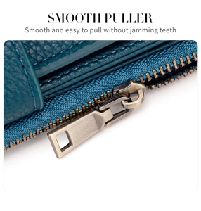 Macro detail of smooth bronze-colored metal zipper puller on teal lychee grain wallet