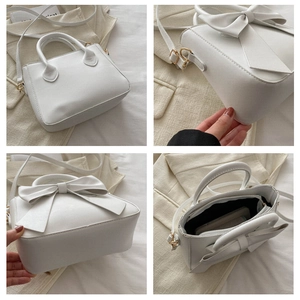 Detail view of white bow handbag with gold hardware and internal structure shots