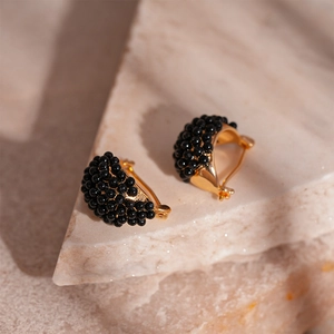 Retro black resin geometric hoop earrings with gold-tone metal and beaded texture