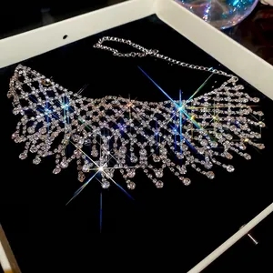 Exaggerated silver fringe necklace with hollow rhinestone mesh design for luxury party look