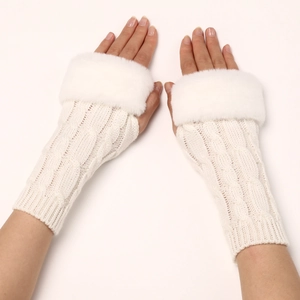 Macro detail of white cable-knit fingerless gloves with soft faux fur cuffs texture